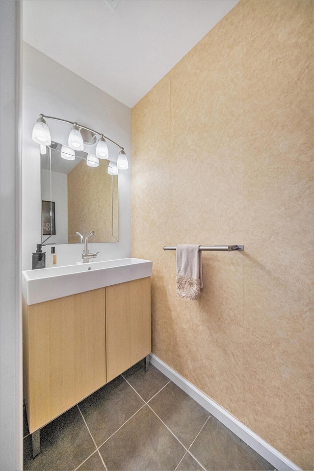 bathroom featuring tile patterned flooring and vanity