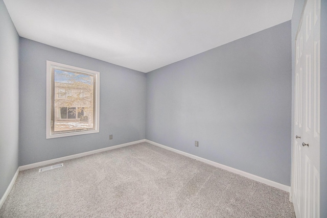 empty room featuring carpet floors