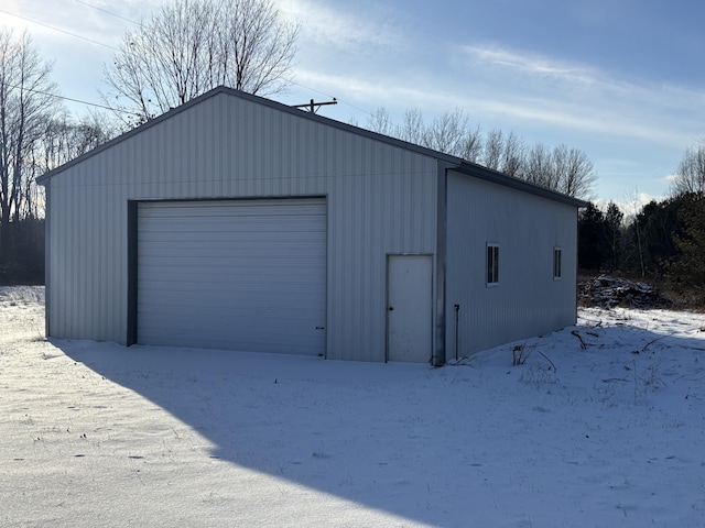 view of snow covered garage