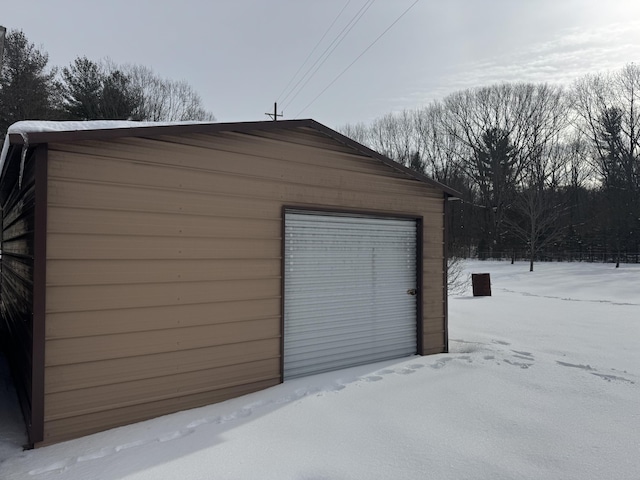 view of snow covered garage