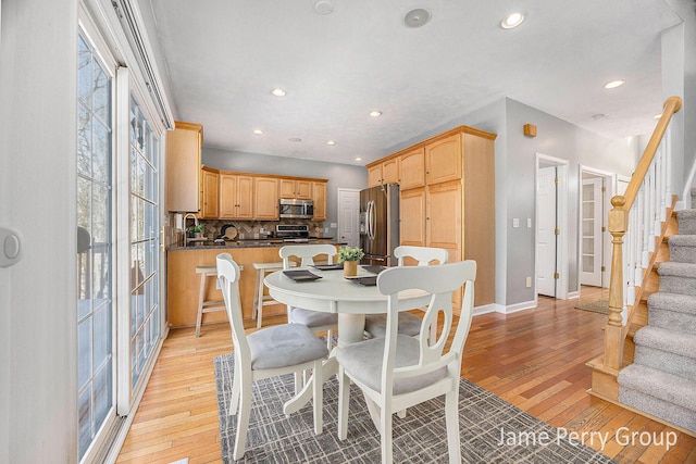 dining room with light hardwood / wood-style flooring