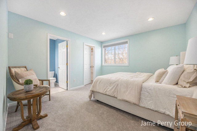 carpeted bedroom with ensuite bathroom