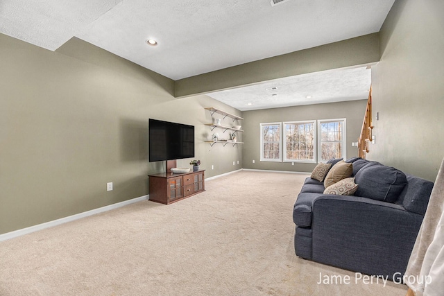 carpeted living room with a textured ceiling