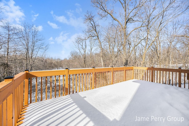 view of snow covered deck