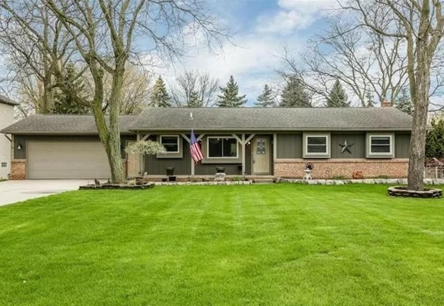 ranch-style house featuring a garage and a front yard