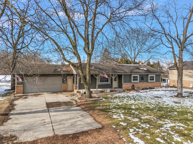 single story home with a garage and a lawn