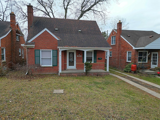 bungalow with a front lawn and covered porch