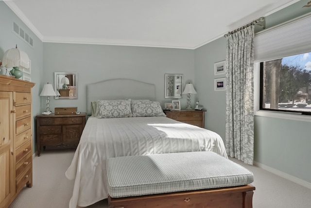 bedroom featuring carpet floors, baseboards, visible vents, and ornamental molding