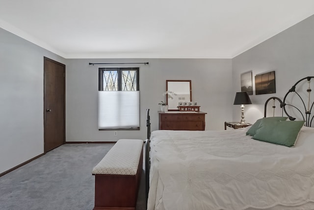 carpeted bedroom with baseboards