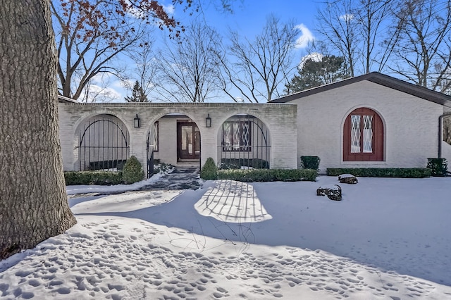 view of front of home featuring brick siding