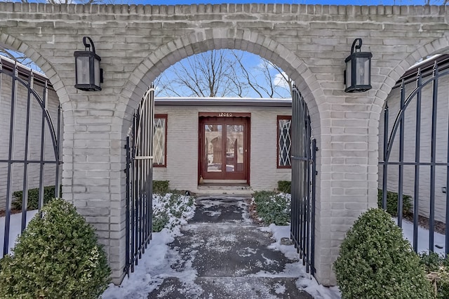 entrance to property with brick siding