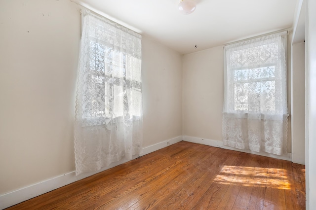 unfurnished room featuring light hardwood / wood-style flooring