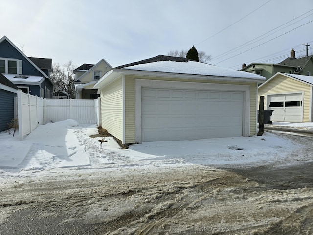 view of snow covered garage