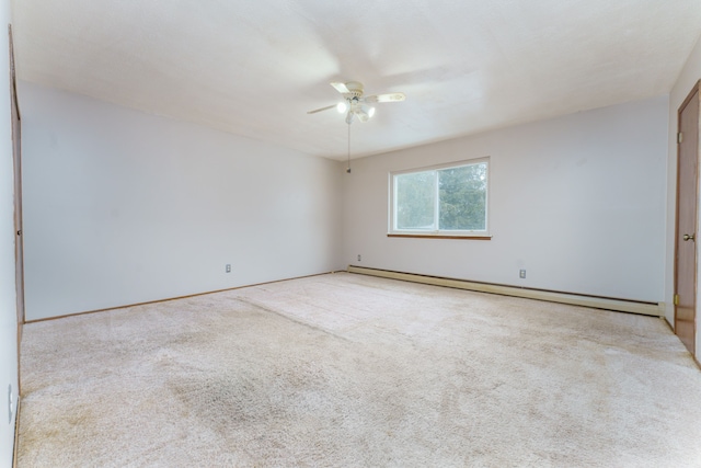 carpeted empty room with a ceiling fan and baseboard heating