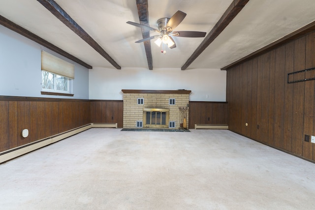 unfurnished living room with baseboard heating, wainscoting, beam ceiling, and wooden walls