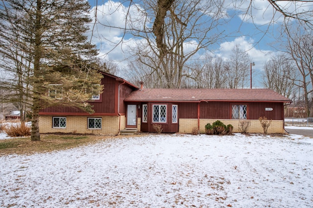 split level home with brick siding