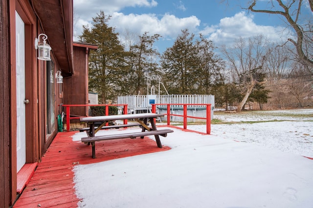 view of snow covered deck