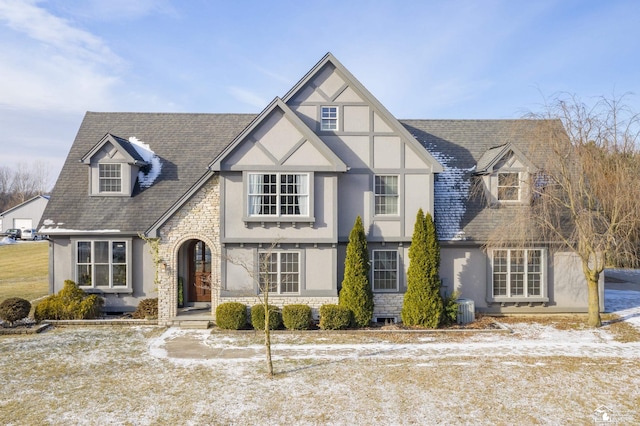 tudor house with central air condition unit