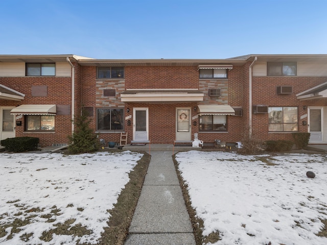 townhome / multi-family property with an AC wall unit