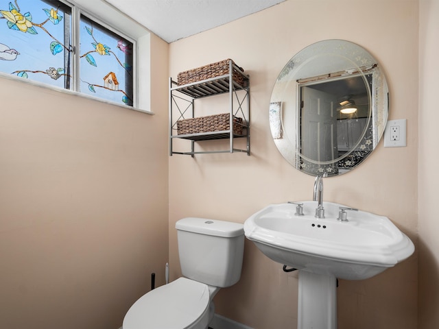 bathroom with toilet and sink