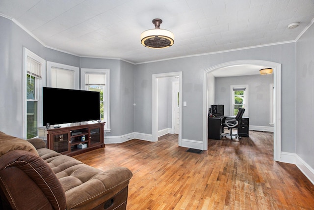 living room featuring hardwood / wood-style flooring and ornamental molding