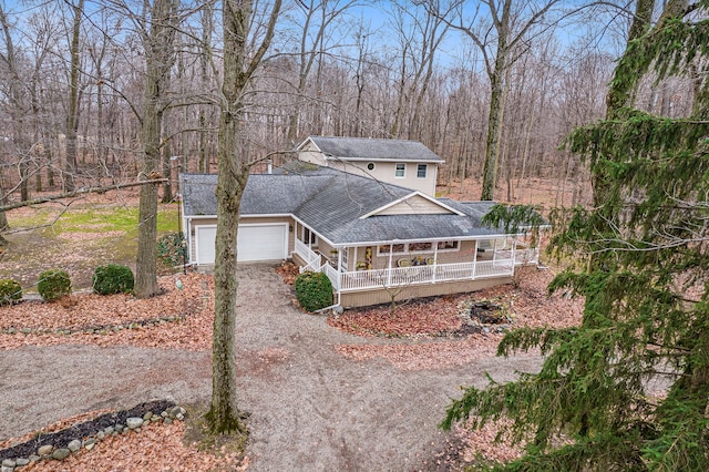 exterior space with a garage and covered porch