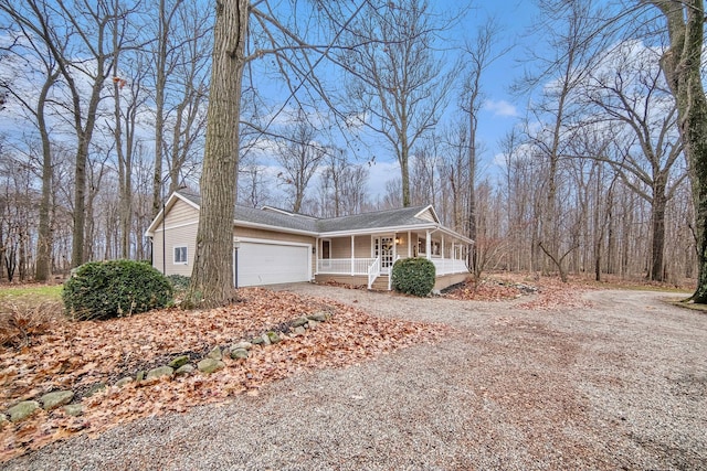 view of front of home with a garage and a porch