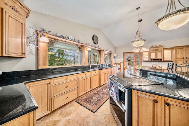 kitchen featuring pendant lighting, plenty of natural light, vaulted ceiling, and range with two ovens