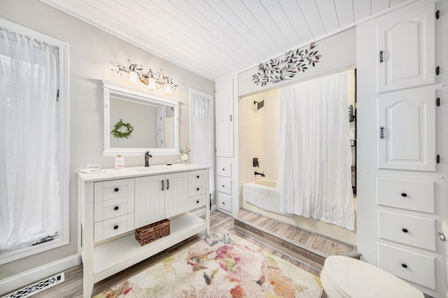 full bathroom featuring toilet, wooden ceiling, vanity, shower / bath combo with shower curtain, and hardwood / wood-style floors