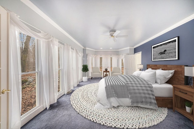 carpeted bedroom featuring crown molding and ceiling fan