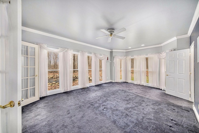 unfurnished sunroom featuring ceiling fan