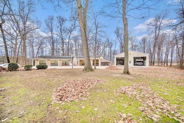 view of yard featuring a carport and covered porch