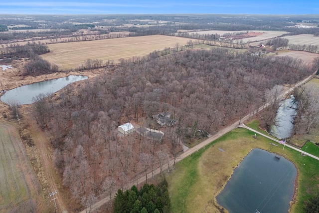 birds eye view of property featuring a water view and a rural view