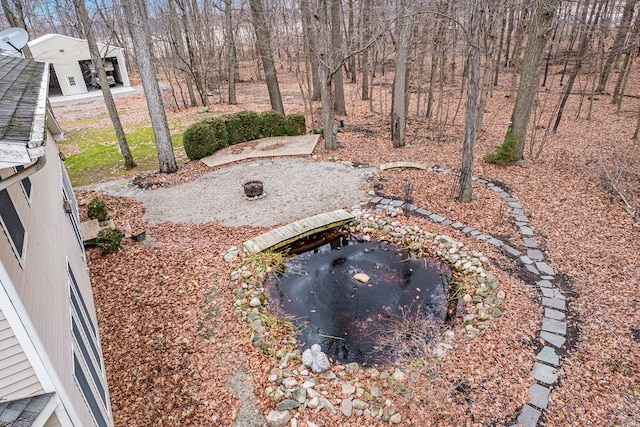 view of yard with a fire pit