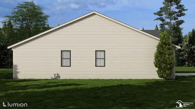 view of side of home with a lawn