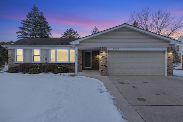 ranch-style home featuring a garage