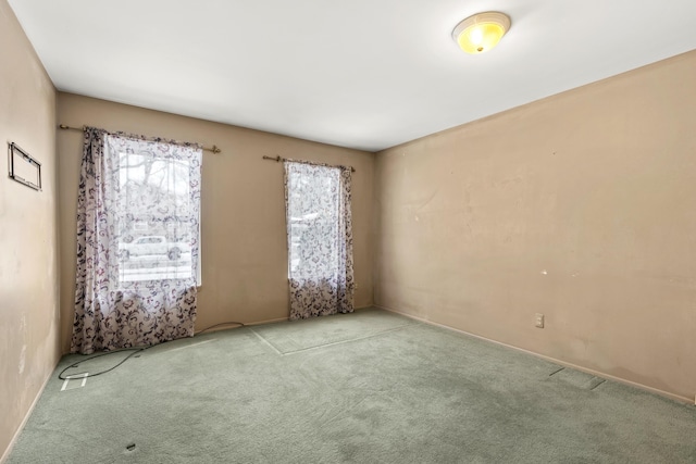 empty room featuring light colored carpet