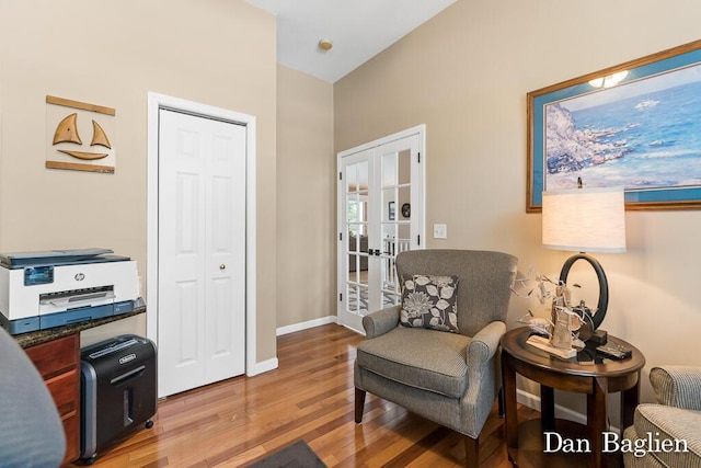 sitting room featuring hardwood / wood-style flooring and french doors