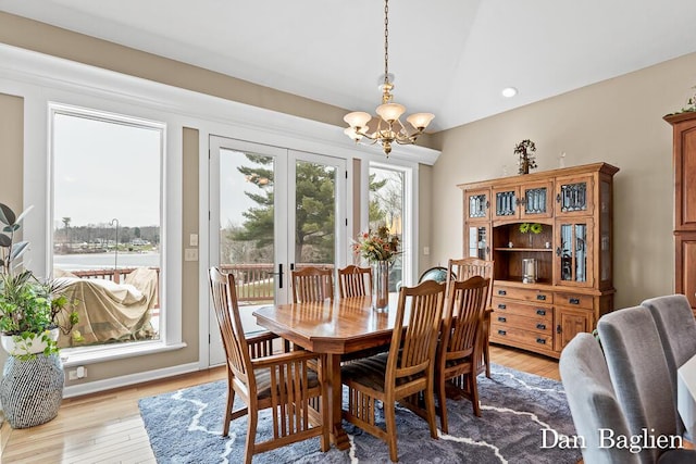 dining room featuring a chandelier and light hardwood / wood-style flooring