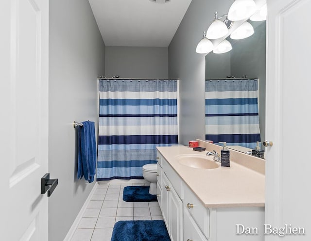 bathroom featuring vanity, walk in shower, tile patterned floors, and toilet