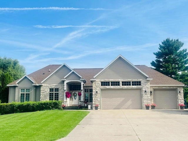 view of front facade with a garage and a front yard