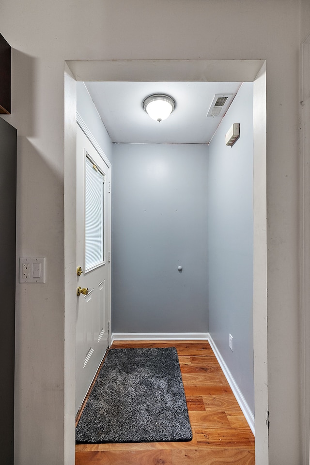 doorway to outside with hardwood / wood-style flooring