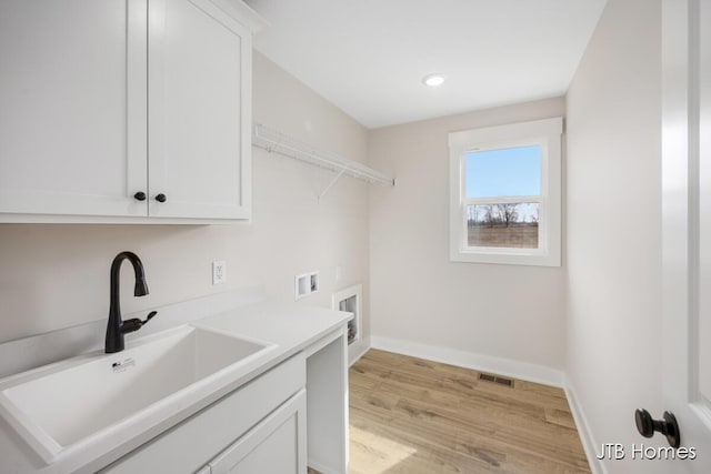 3432 Conrail Dr, Byron Center, MI 49315 - laundry room with cabinet space, hookup for a washing machine, light wood-style floors, baseboards, and recessed lighting