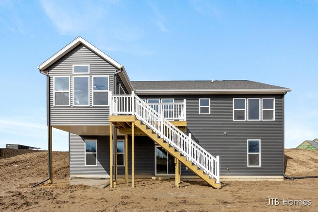 3432 Conrail Dr, Byron Center, MI 49315 - rear view of property featuring stairs, a wooden deck, and roof with shingles