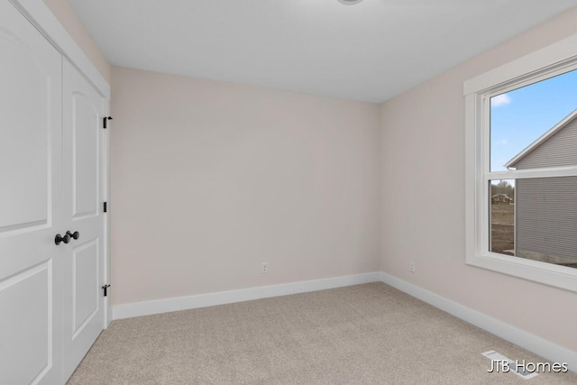 3432 Conrail Dr, Byron Center, MI 49315 - unfurnished bedroom featuring carpet floors and baseboards