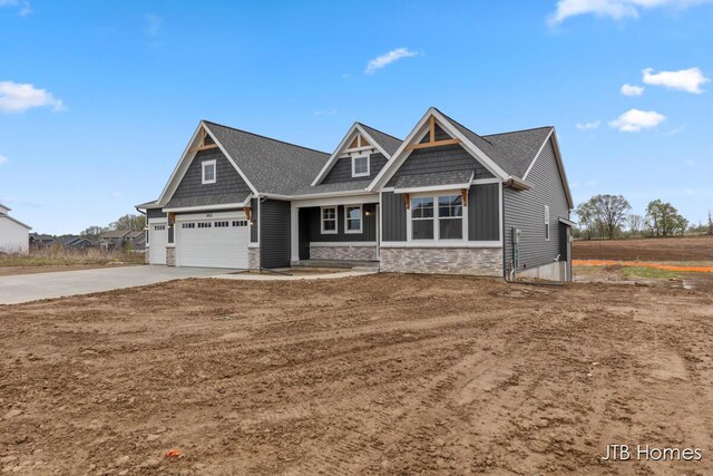 3432 Conrail Dr, Byron Center, MI 49315 - craftsman house featuring stone siding, driveway, and an attached garage