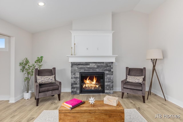 3432 Conrail Dr, Byron Center, MI 49315 - sitting room with wood finished floors, baseboards, vaulted ceiling, a fireplace, and recessed lighting