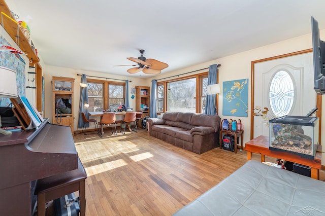 living room featuring hardwood / wood-style flooring and ceiling fan