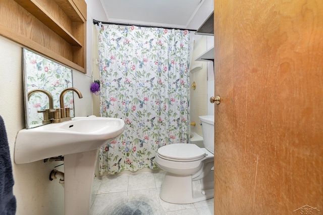 bathroom with toilet, tile patterned flooring, and shower / bath combo