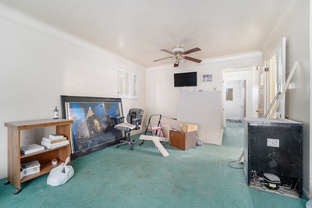 carpeted living room with ceiling fan